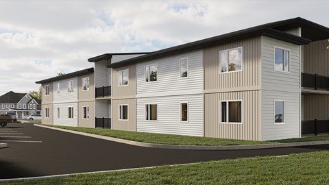 A row of modern townhouses with a car parked in front.