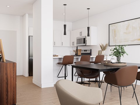 A modern kitchen with a dining table and chairs.