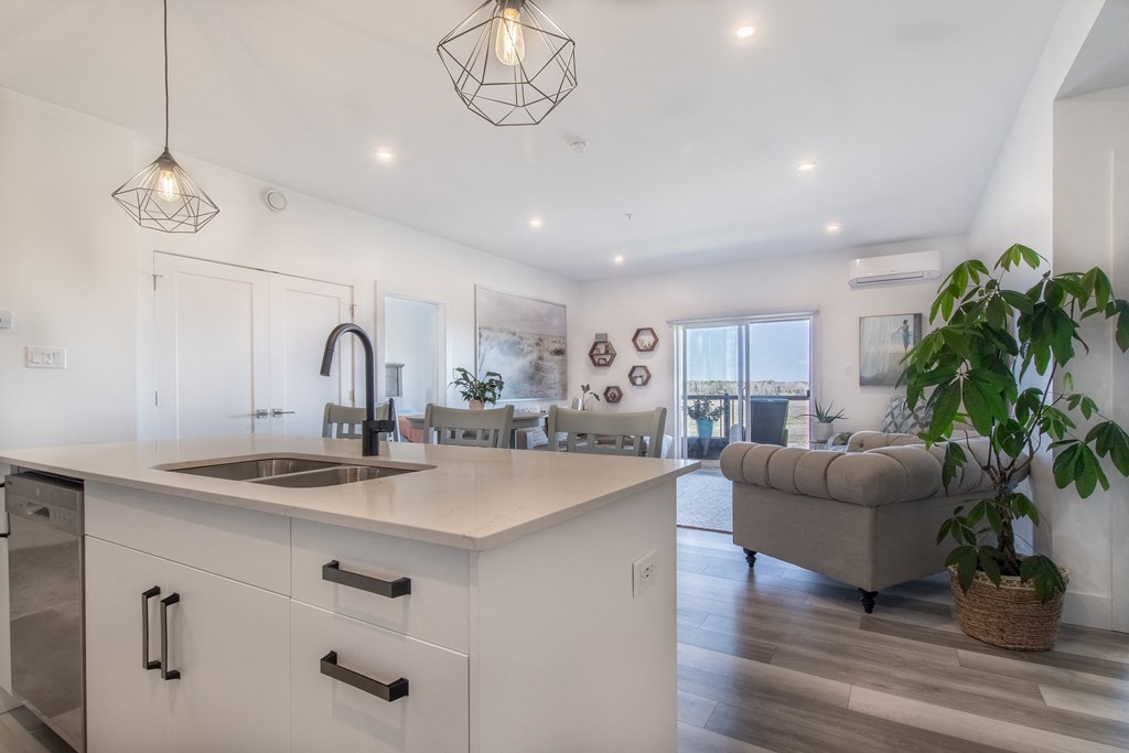 an open floor plan with a kitchen and living room