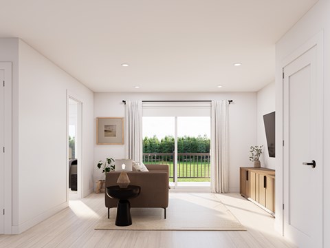 A modern living room with a brown sofa and a black table.