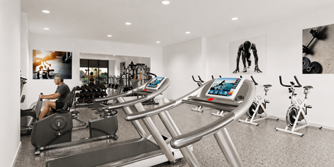 A man is working out on a treadmill in a gym.