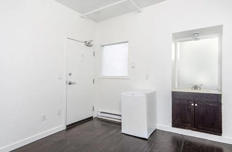 A white bathroom with a toilet and sink.