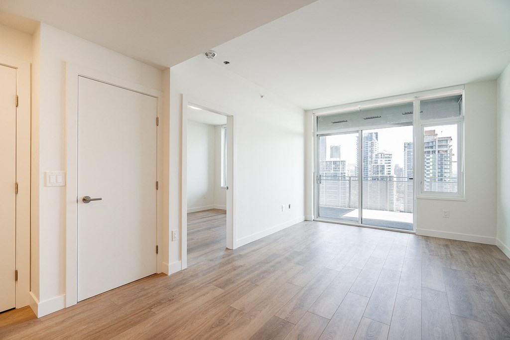 Living and dining areas of a one bedroom unit. Unit may be "similar" to the picture shown, but may not be exactly the same.