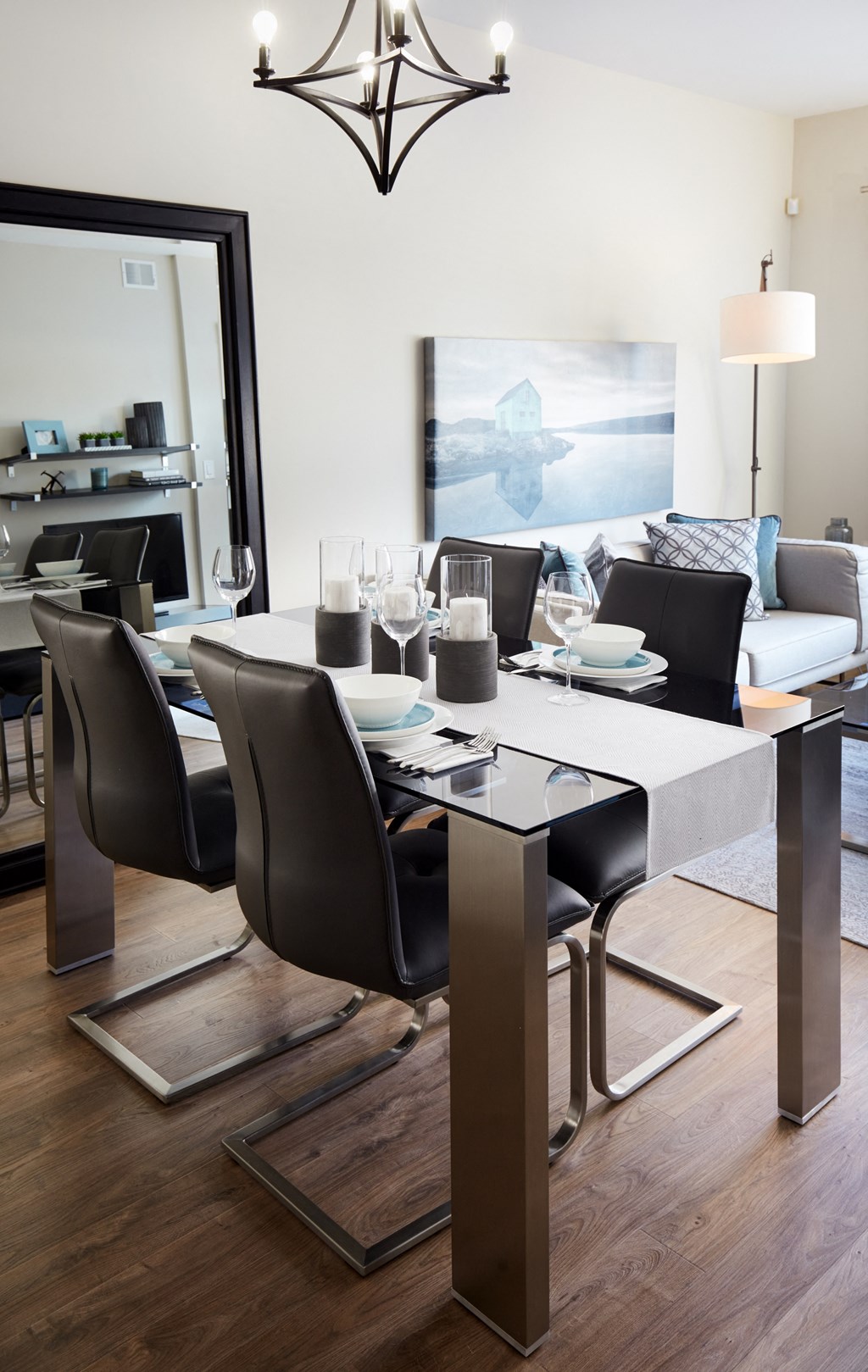 a dining room with a table and chairs and a living room