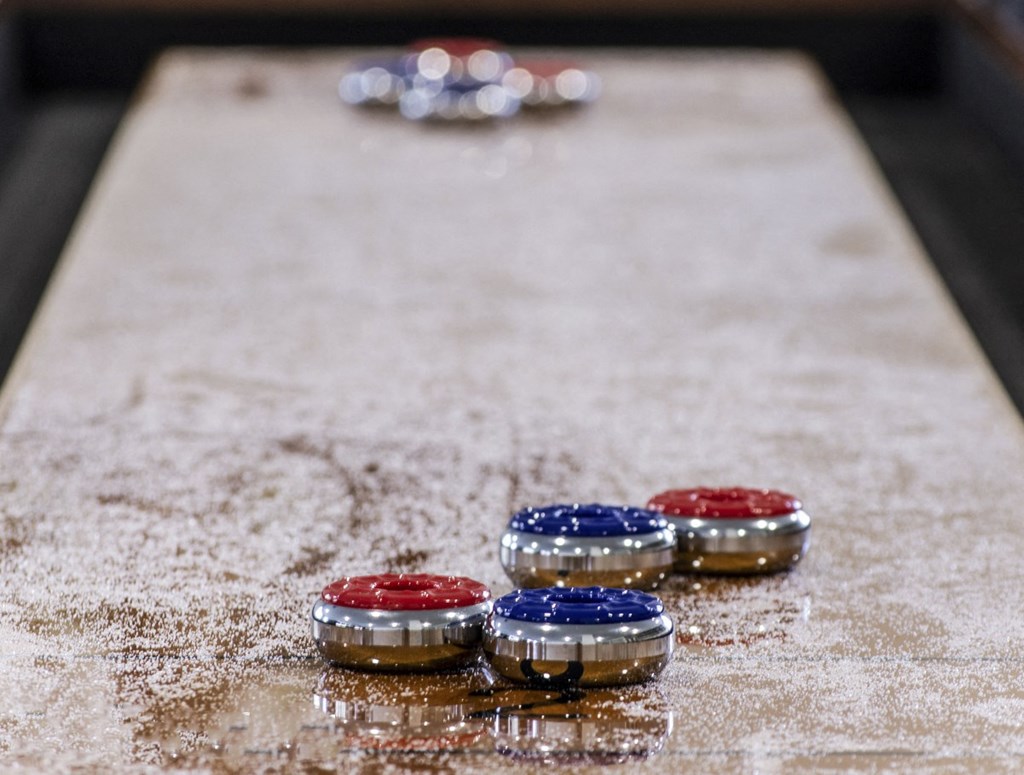 a set of red white and blue poker chips on a table