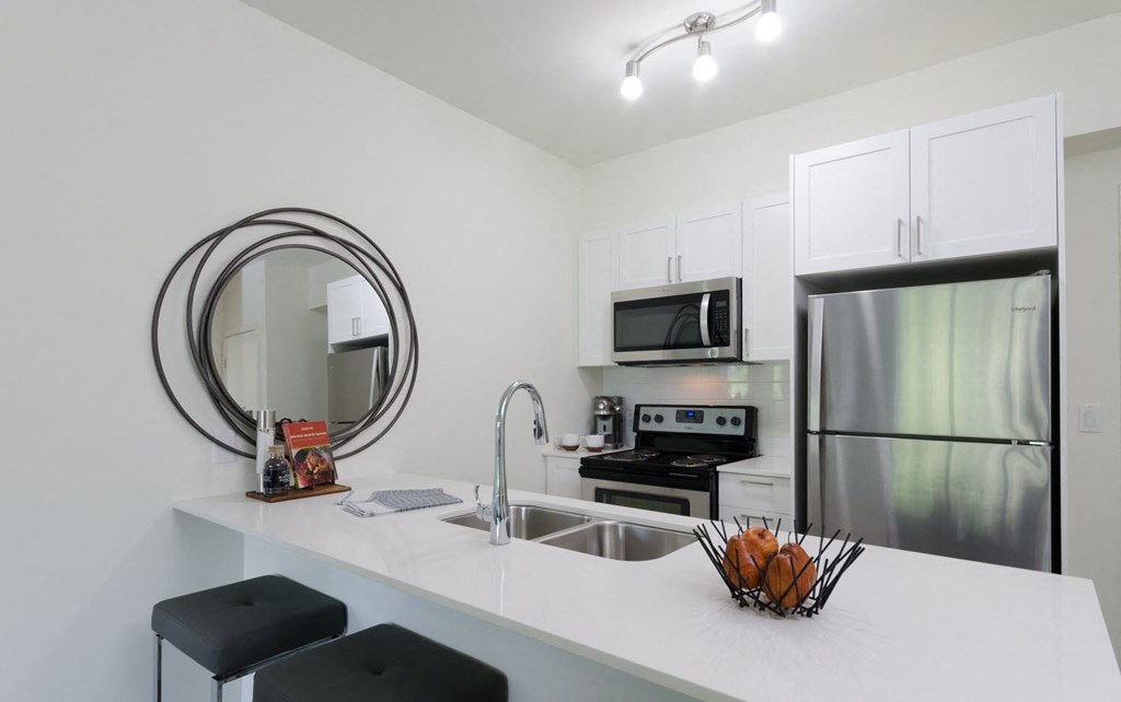 a kitchen with a sink and a refrigerator