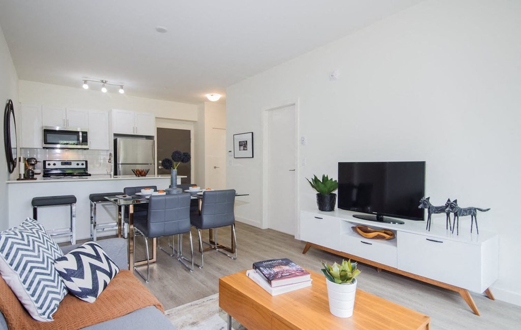 a living room with a couch and a table and a television