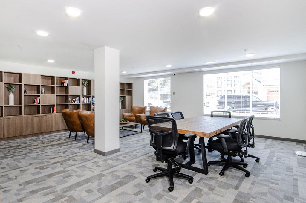 a conference room with a table and chairs