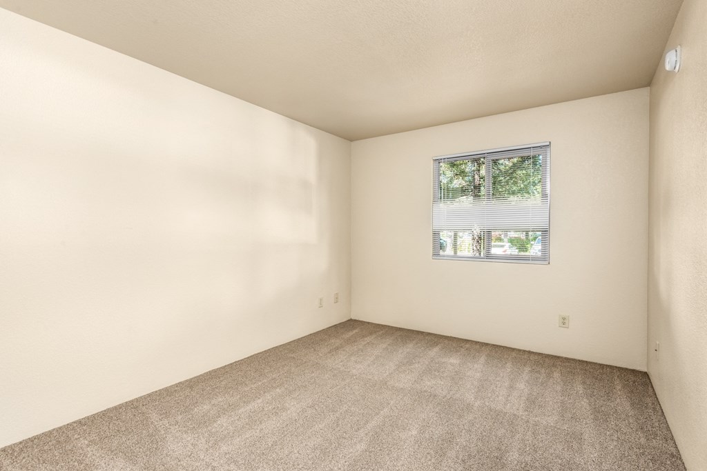 Bedroom With Expansive Window at Meadowrock Apartments, California