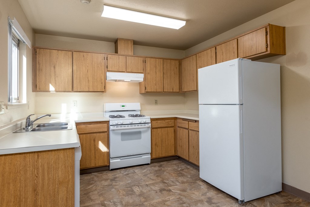 Modern Kitchen With White Cabinet at Meadowview Apartments, California
