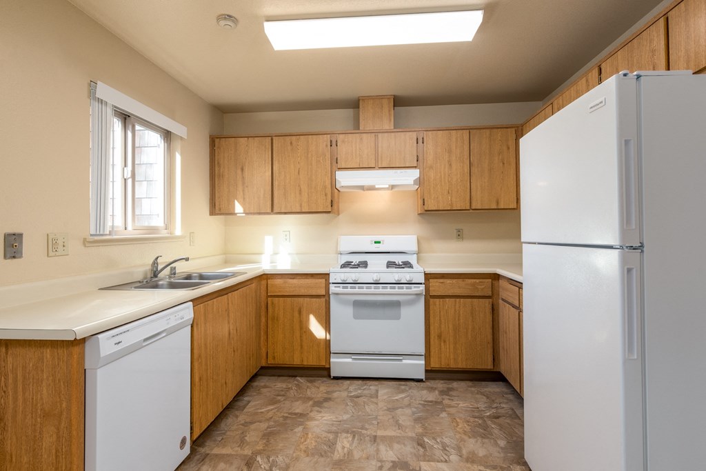 Modern Kitchen With Stainless Steel Appliances And Double Door Refrigerators at Meadowview Apartments, Santa Rosa