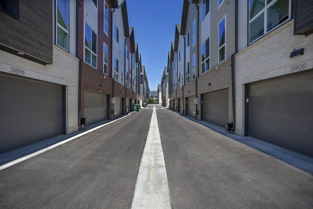 View down the alley way of townhome garages.