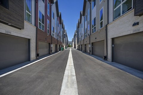 View down the alley way of townhome garages.