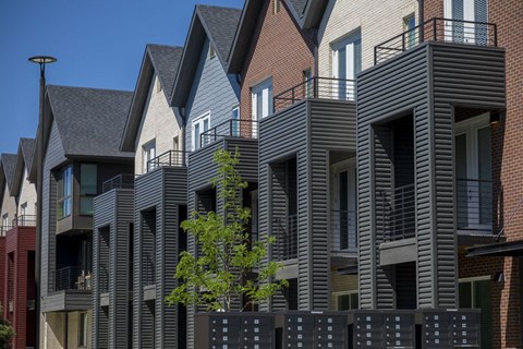 Outdoor view of townhome balconies on the second and third floors.