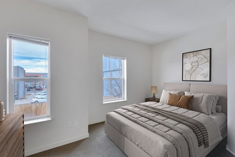 bedroom with two large windows, bedroom and dresser
