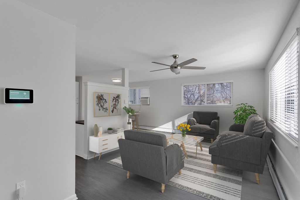 view of a living room with a couch and small seats