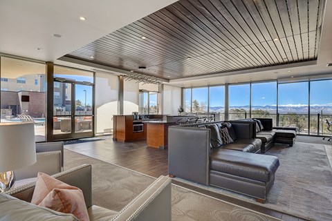 resident lounge with couches, work form home stations and mountain views