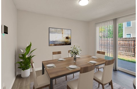 Spacious dining room with sliding glass door leading to the backyard.