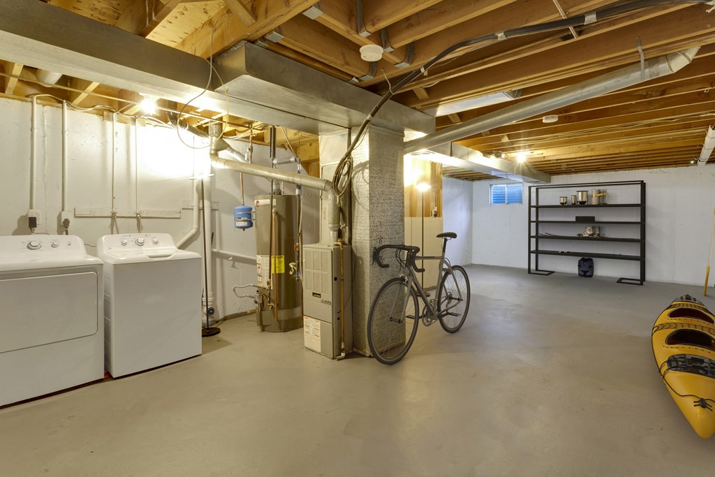 Spacious basements that include a full sized washer and dryer