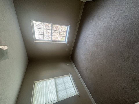 A room with a window and a skylight.