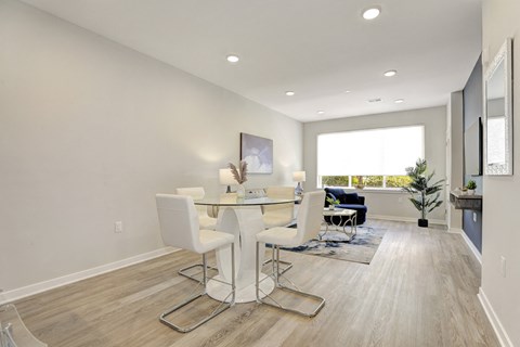 a dining room with a table and chairs