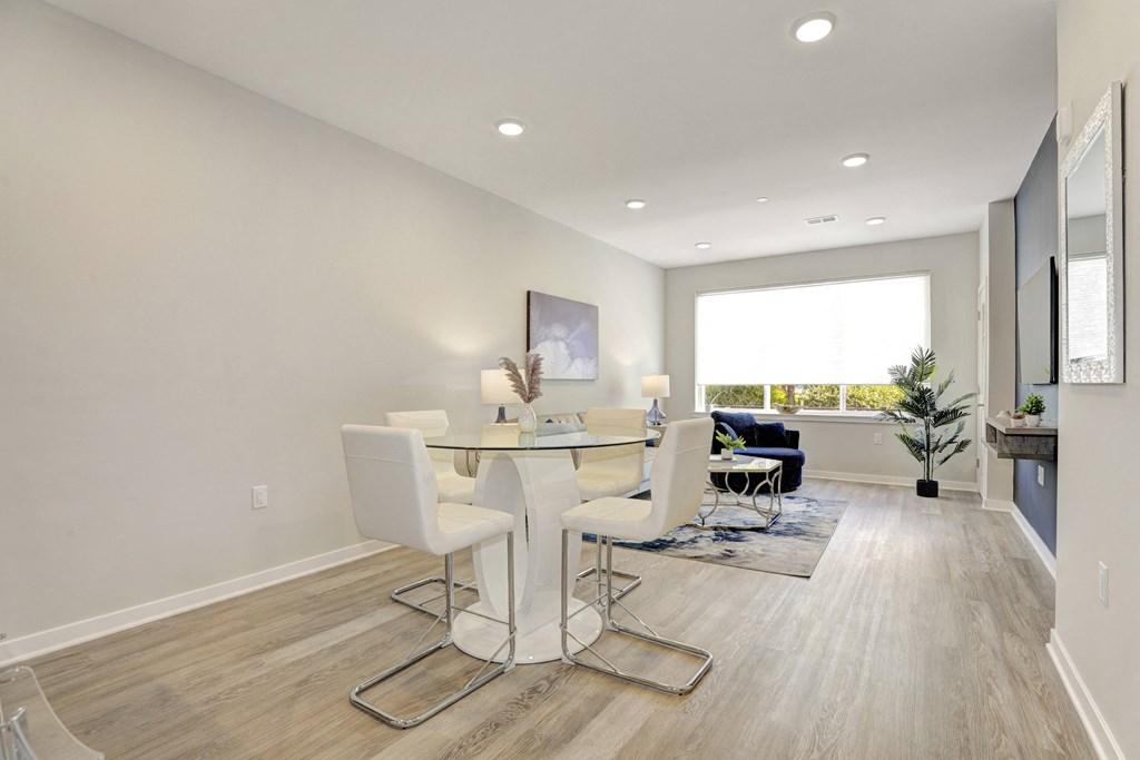 a dining room with a table and chairs