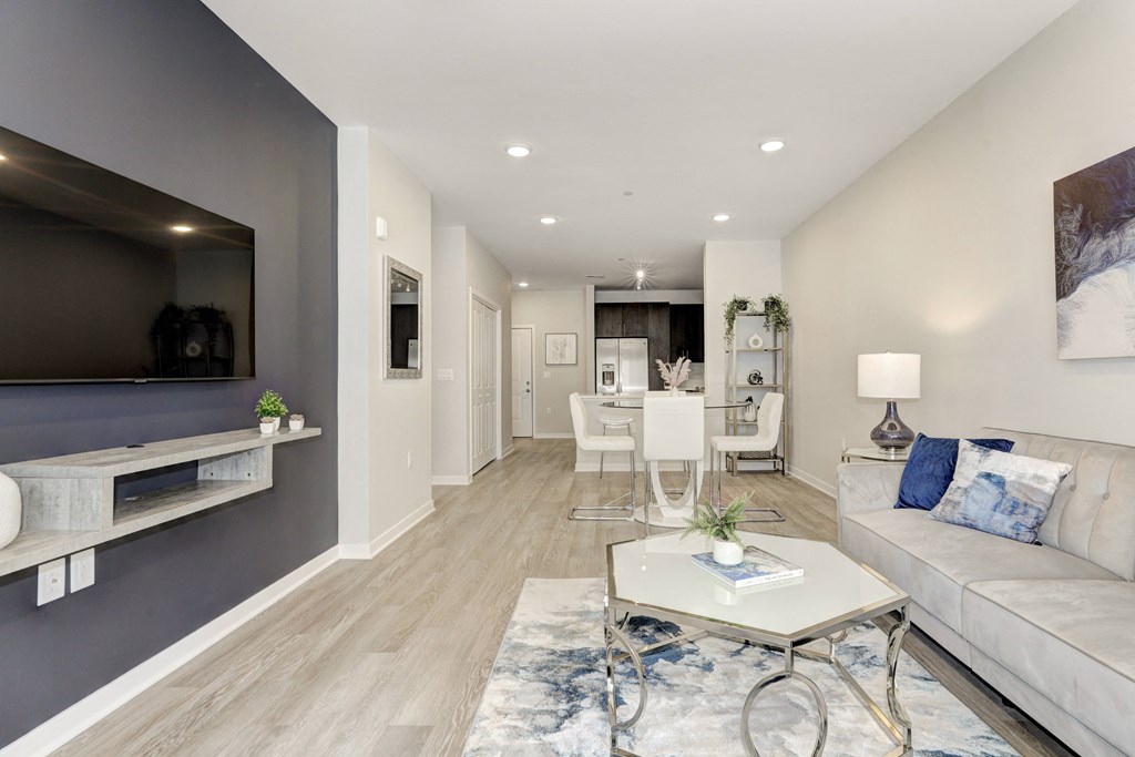 a living room with a couch a table and a tv