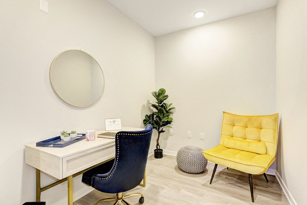 a home office with two chairs and a desk