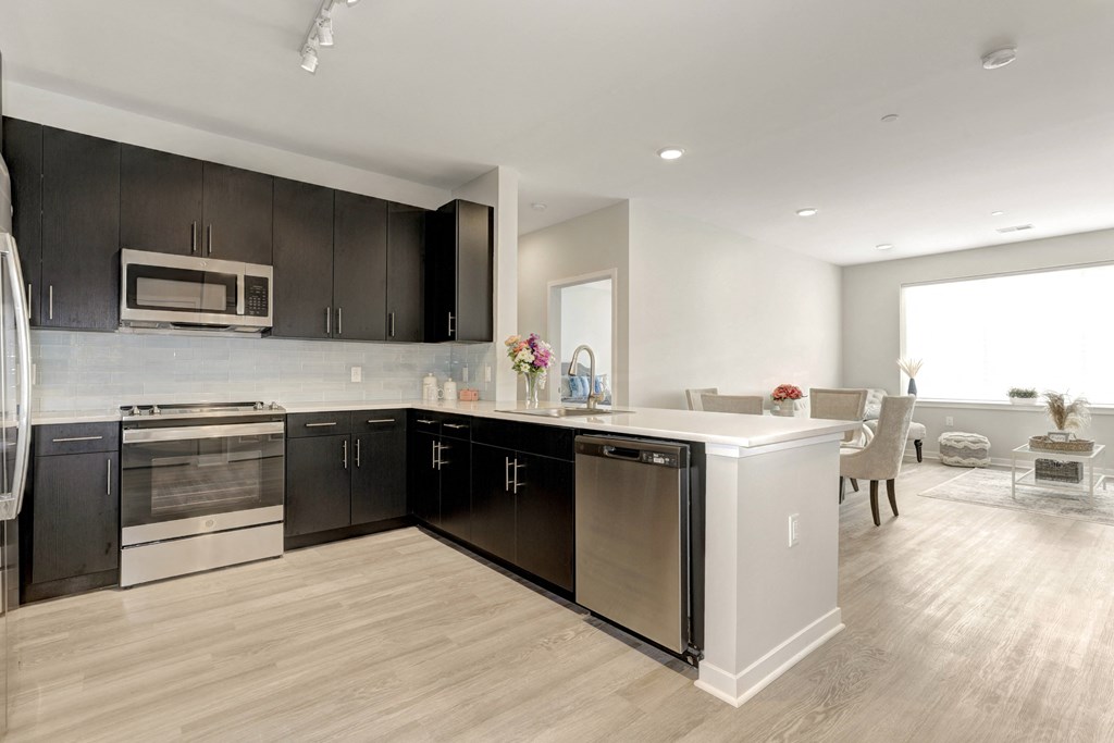 a kitchen and dining area in a 555 waverly unit