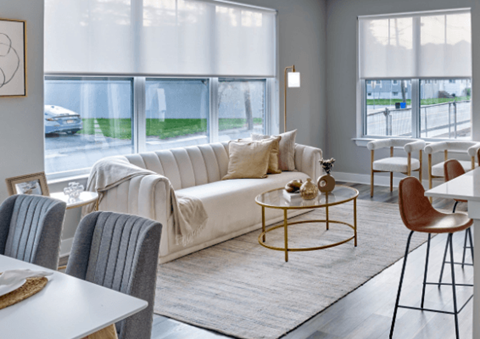 A living room with a white couch and a coffee table.