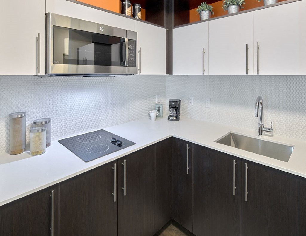 a kitchen with a sink and a microwave