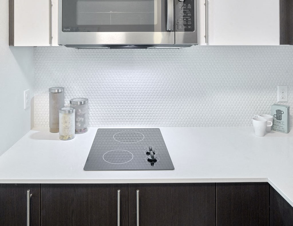 a kitchen with a microwave and a counter top