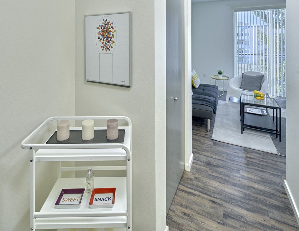 a view of a living room and a dining room with furniture