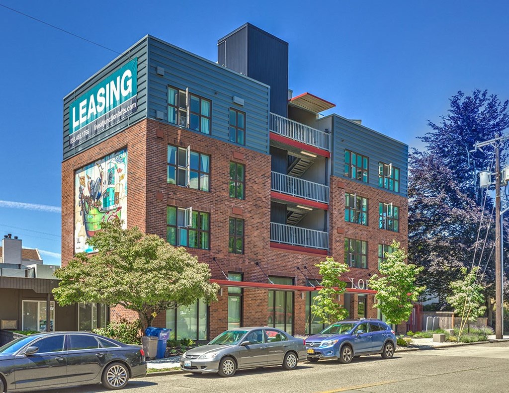 a building with a sign on the side of a street