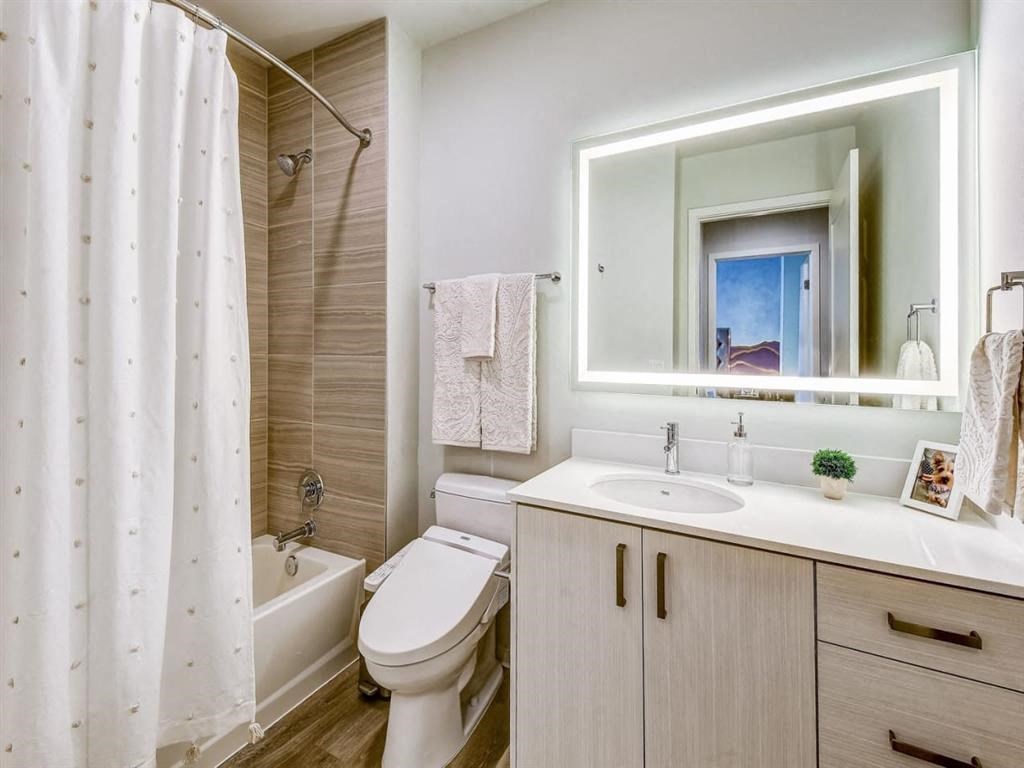 a bathroom with a sink toilet and a shower