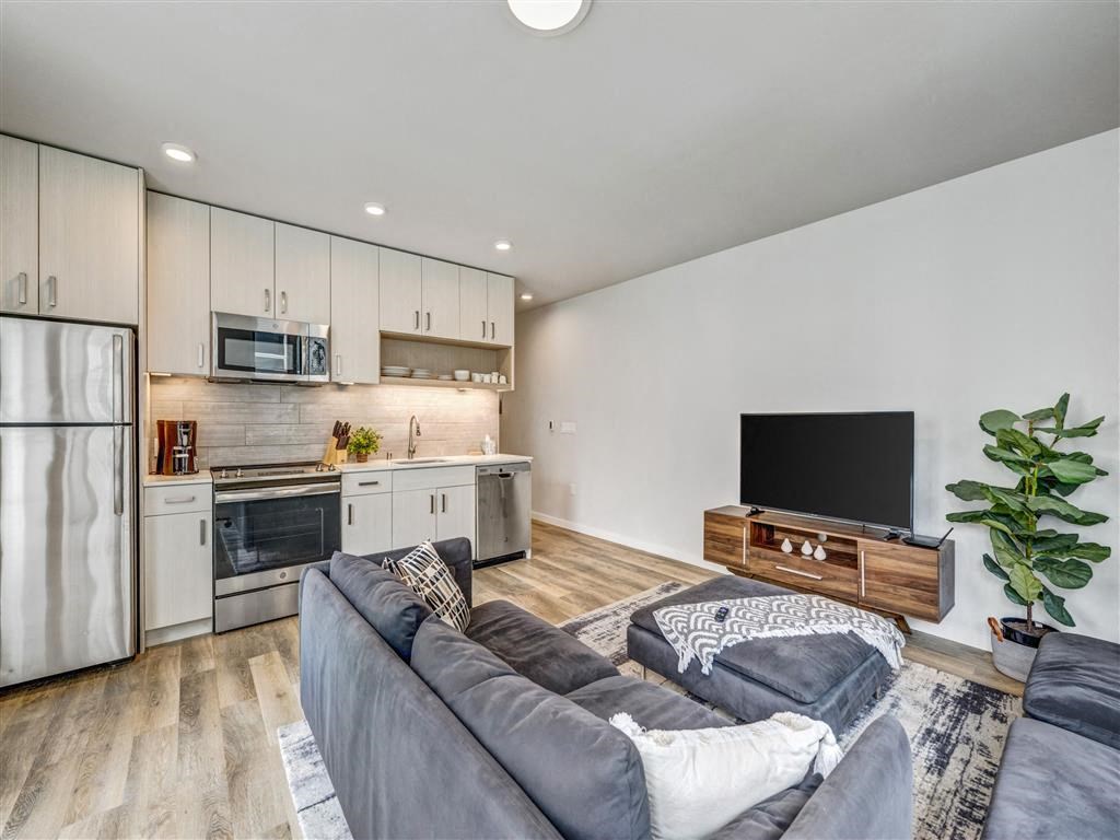 a living room with a couch and a tv