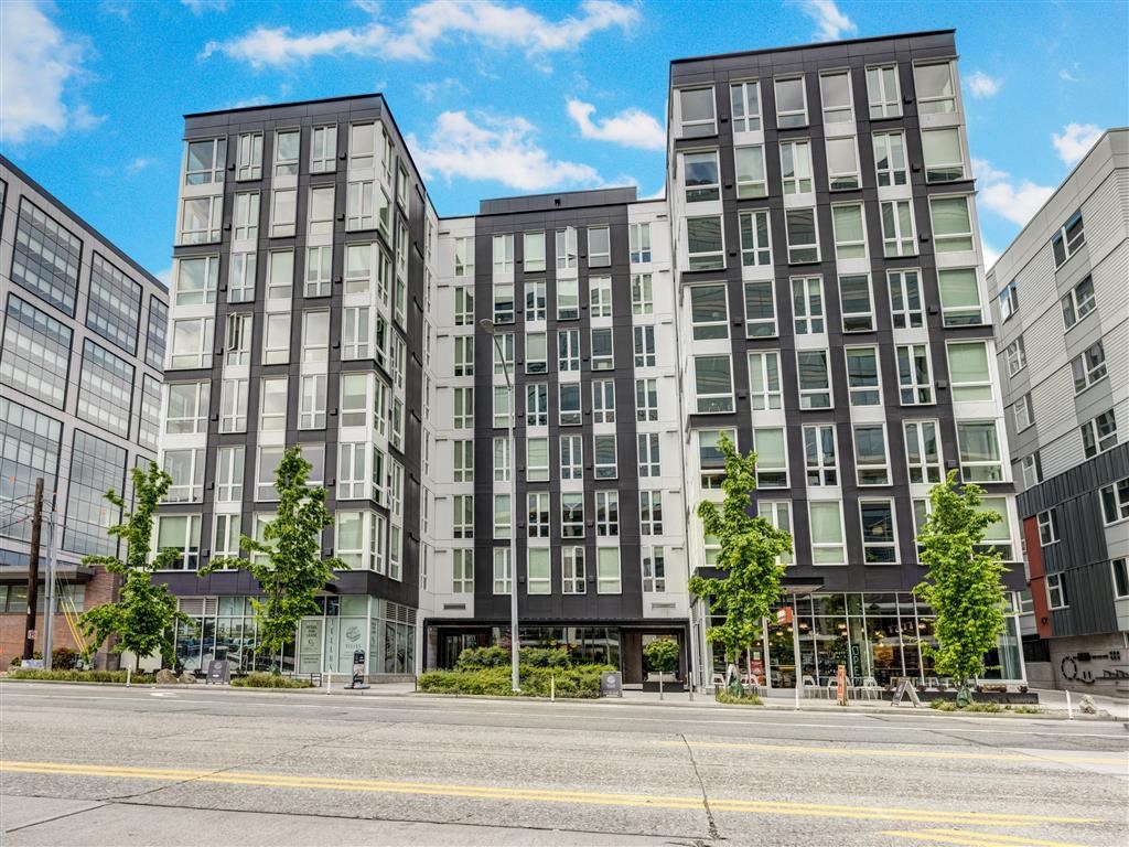 modern apartment buildings on the corner of a street