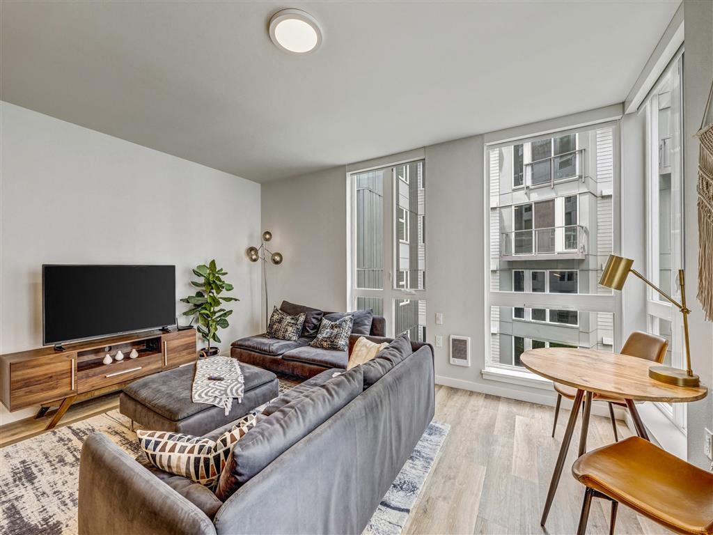 a living room with a couch and a tv