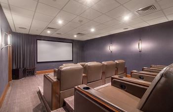 a small conference room with chairs and a screen on the wall  at HIGHGROVE, Stamford, 06901