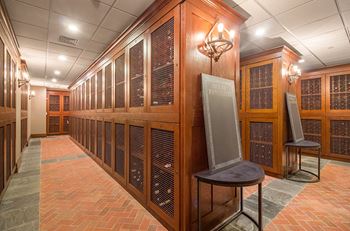 a large room filled with wooden cabinets and a large screen television  at HIGHGROVE, Stamford, Connecticut