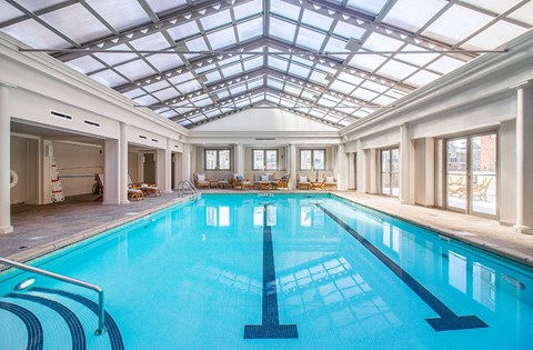 the indoor swimming pool is under a glass ceiling at HIGHGROVE, Stamford, CT, 06901