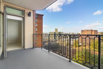 a balcony with a door and a view of the city at HIGHGROVE, Stamford, 06901