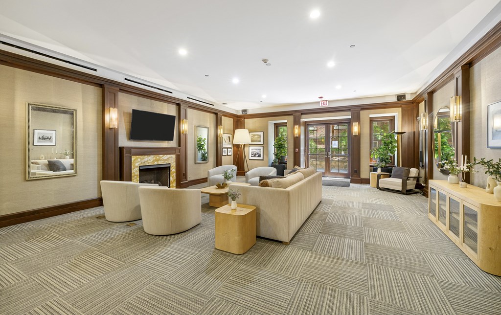 a large living room with furniture and a fireplace at HIGHGROVE, Stamford, Connecticut
