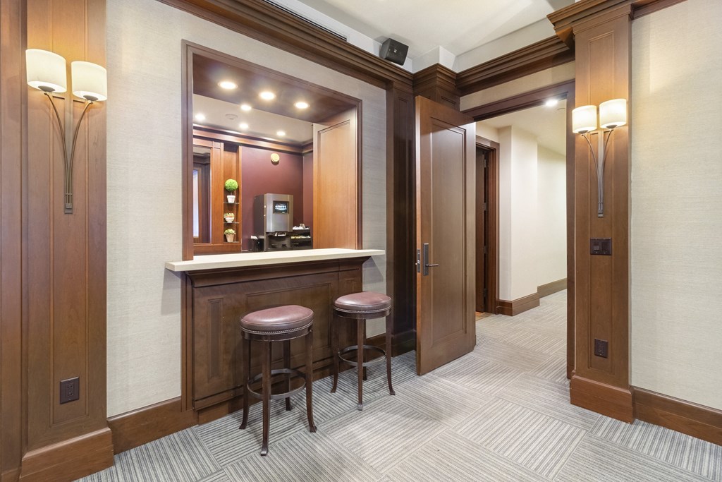 a small bar in a room with two doors and two stools at HIGHGROVE, Connecticut