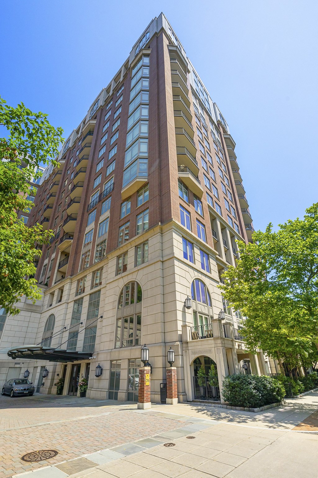 a tall building on the corner of a city street at HIGHGROVE, Stamford, CT, 06901