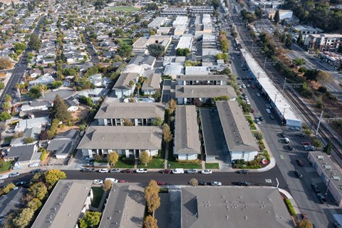 A large building with a parking lot in front of it.