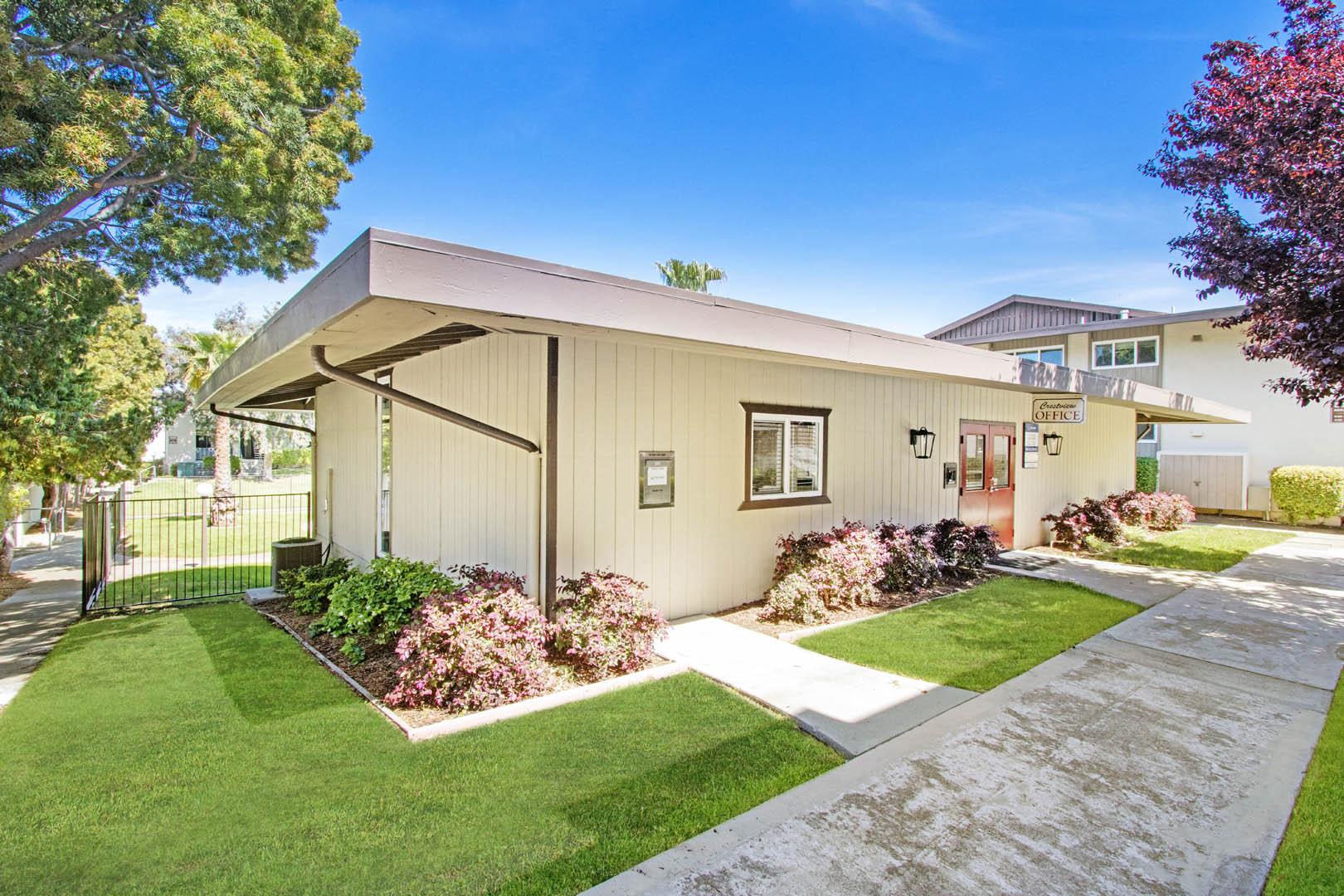 a house with a sidewalk and grass in front of it
