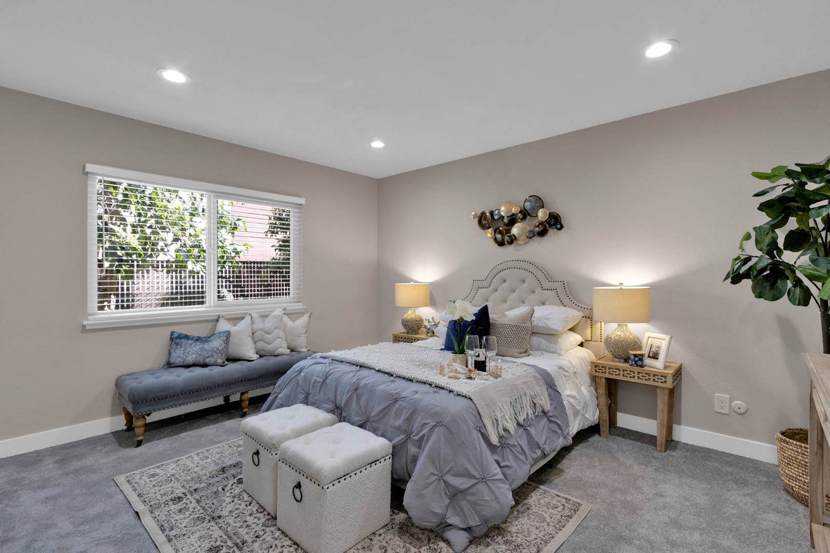 a bedroom with a bed and a window