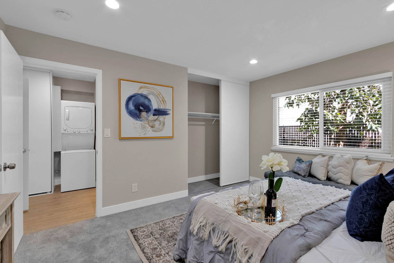 a bedroom with a bed and a window