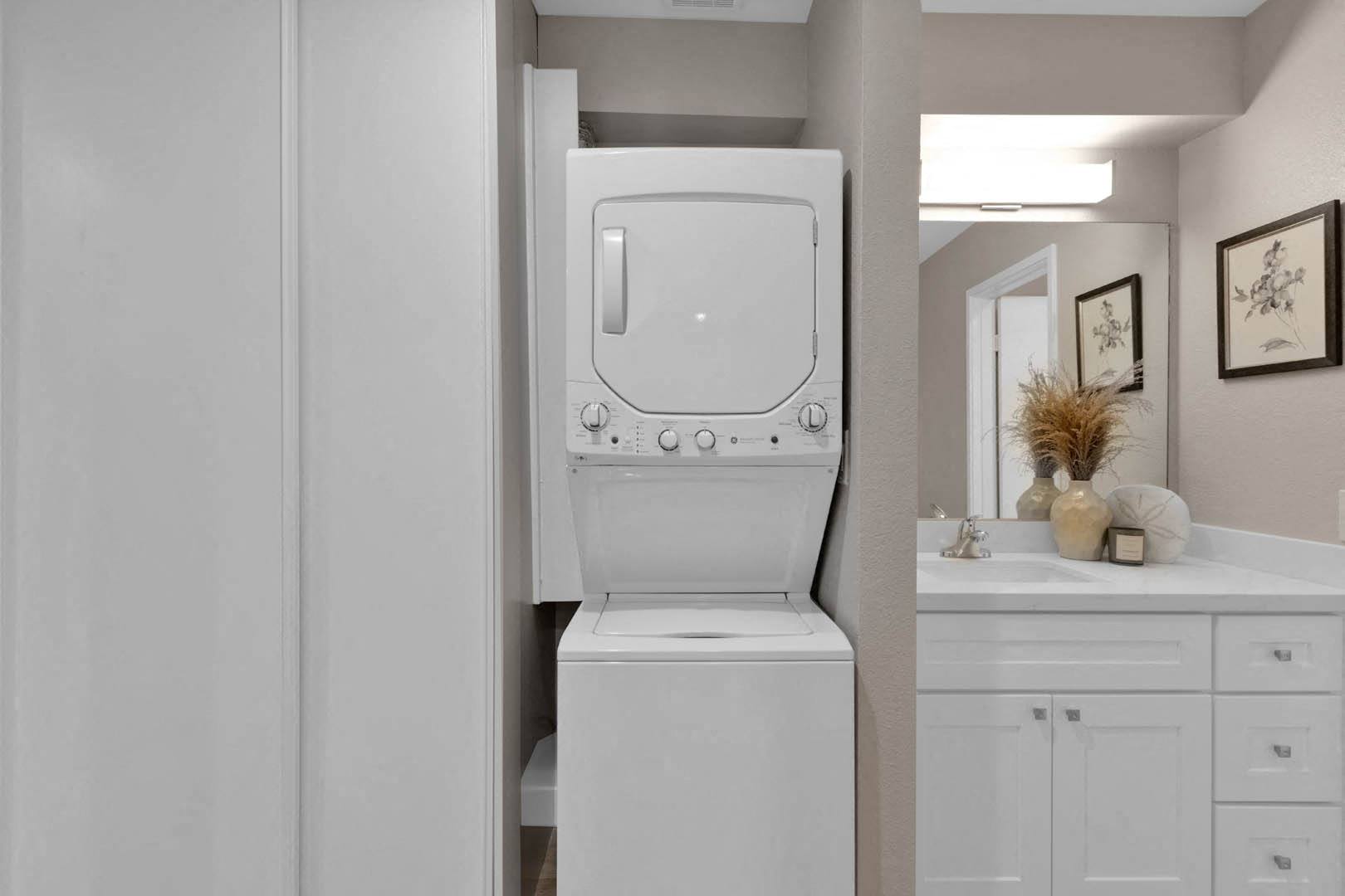 a white washer and dryer in a bathroom